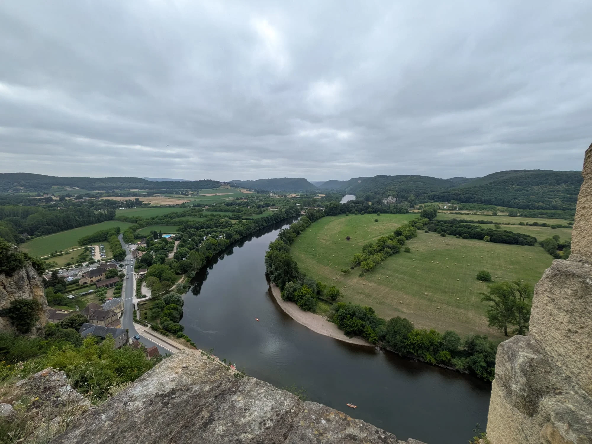 View from Château de Beynac over a bend in the Dordogne towards the far bank and distant hills